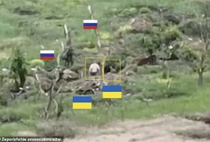 Chilling evidence has emerged of the brutal execution of two Ukrainian prisoners of war held by Vladimir Putin 's troops. Pictured: Two Ukrainian troops in Robotyne in Ukraine 's Zaporizhzhia region