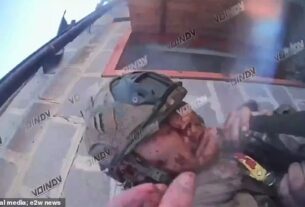 The astonishing moment a wounded Ukrainian soldier and his Russian foe emotionally paid their respects to each other as the fighter took his final breaths after being slashed by Putin 's serviceman in a knife fight was captured on camera