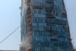 Workers were seen walking away from the building slowly when it began to topple as the tremors shook the Thai capital