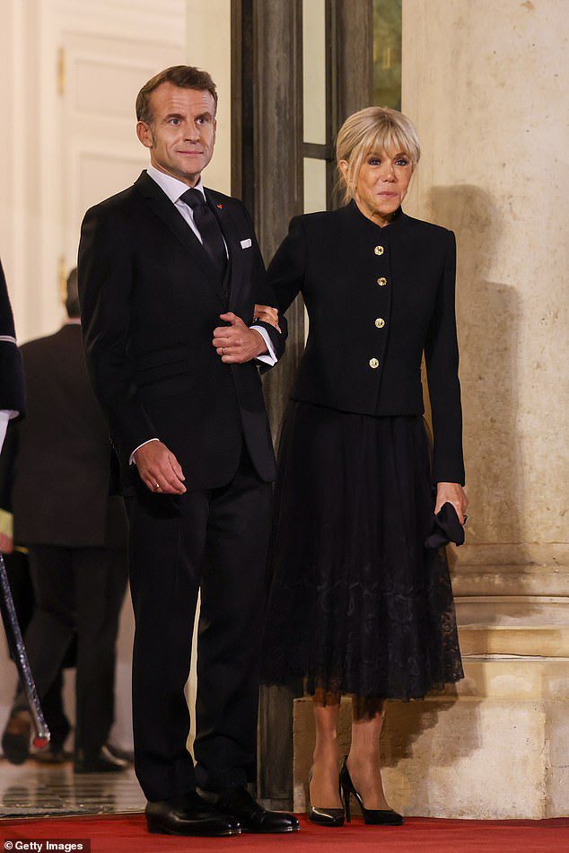 France's President Emmanuel Macron and First Lady Brigitte Macron are seen at the Elysee Palace dinner as part of the Paris Peace Forum at Elysee Palace on October 29, 2025 in Paris, France