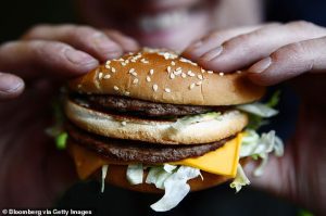 Man, 22, fights for life after swallowing a whole burger without chewing it ‘for a joke’