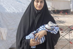 British Jihadi wife Shamima Begum pictured with her week old son Jerah in Al Hawl camp for captured ISIS wives in children, Kurdish Syria. Undated