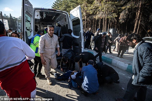 Iranian emergency services arrive at the site where two explosions in quick succession struck a crowd marking the anniversary of the 2020 killing of Guards general Qasem Soleimani, near the Saheb al-Zaman Mosque in the southern Iranian city of Kerman on January 3, 2024