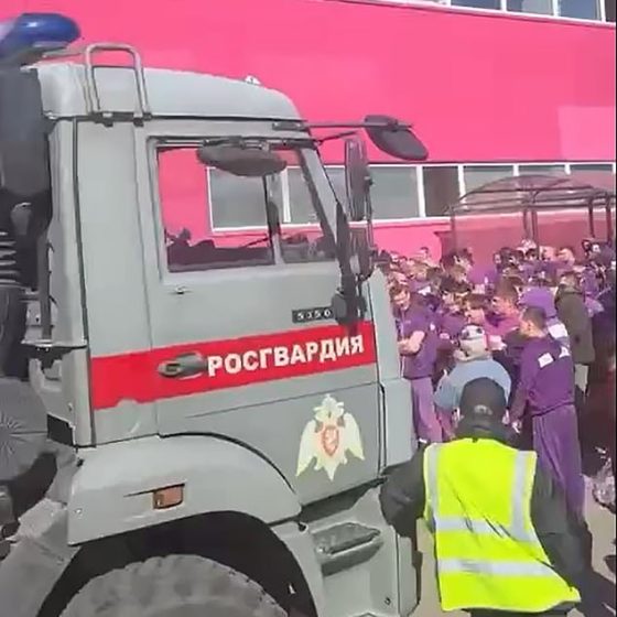 Vehicles emblazoned with Rosgvardiya (Rosguard, the National Police) were seen outside the warehouse in Moscow as officials rounded up illegal migrants, some destined for Ukraine