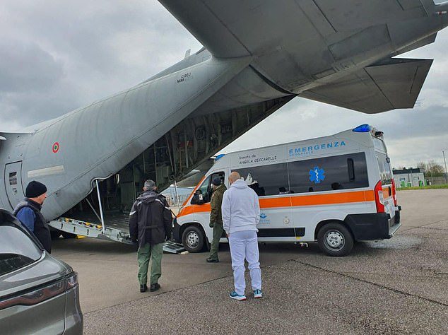 A specially modified ambulance being loaded onto a plane with military and medical personnel ready to fly to Bristol to collect the seriously baby from Bristol Royal Hospital for Children