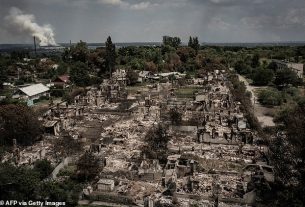 An aerial view shows destroyed houses after strike in the town of Pryvillya at the eastern Ukrainian region of Donbas on June 14, 2022