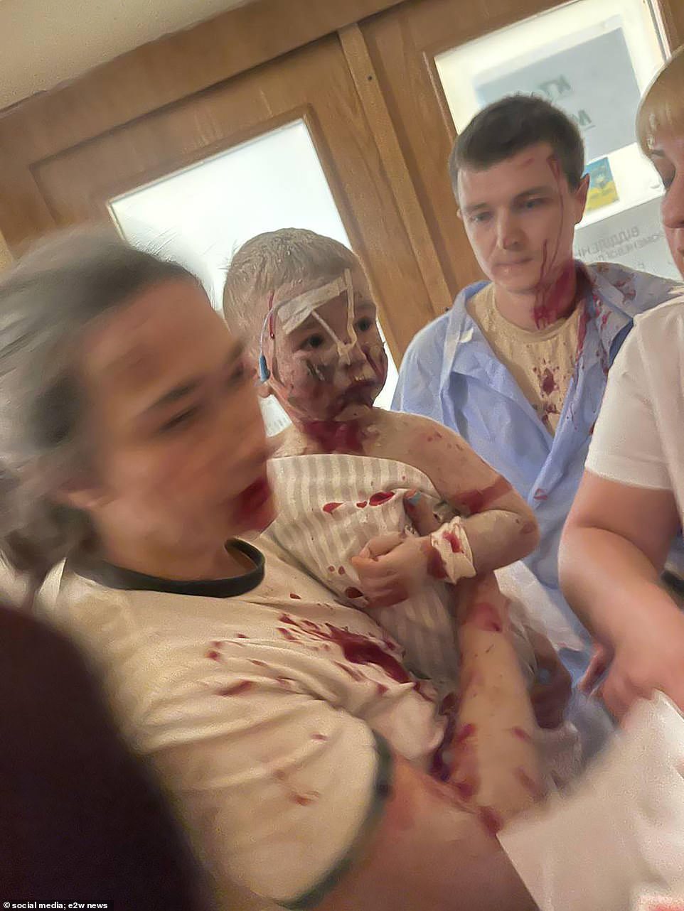Russian missiles have struck a children's hospital in Kyiv and killed at least three people elsewhere in the Ukrainian capital, authorities have said. In shocking footage, a woman is seen carrying a young child, along side a medical worker. All three are covered in blood