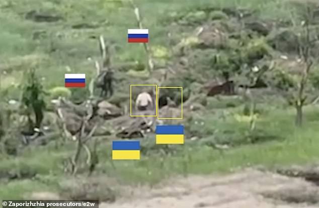 Chilling evidence has emerged of the brutal execution of two Ukrainian prisoners of war held by Vladimir Putin 's troops. Pictured: Two Ukrainian troops in Robotyne in Ukraine 's Zaporizhzhia region