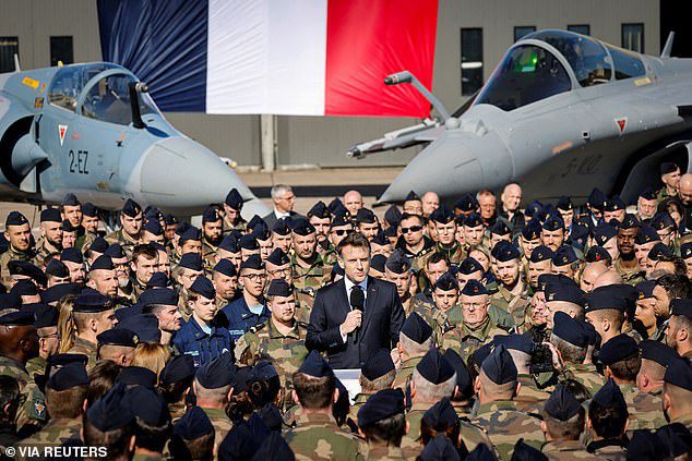President Emmanuel Macron delivers a speech in front of Dassault Rafale and Dassault Mirage 2000 fighter aircrafts during his visit to the French Air and Space Force on Tuesday, where he revealed French nuclear-armed warplanes will be sent to the German border