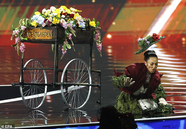 Miss Great Britain stunned audiences after appearing to fall flat on her face during the Miss Universe 2025 national costume competition in Thailand. Footage shows Danielle Latimer, 36, stepping onto the stage wearing a look inspired by Eliza Doolittle