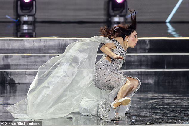 As Mariia Zheliaskova (pictured) was being introduced, she tumbled onto her side, before quickly getting up with an embarrassed look on her face