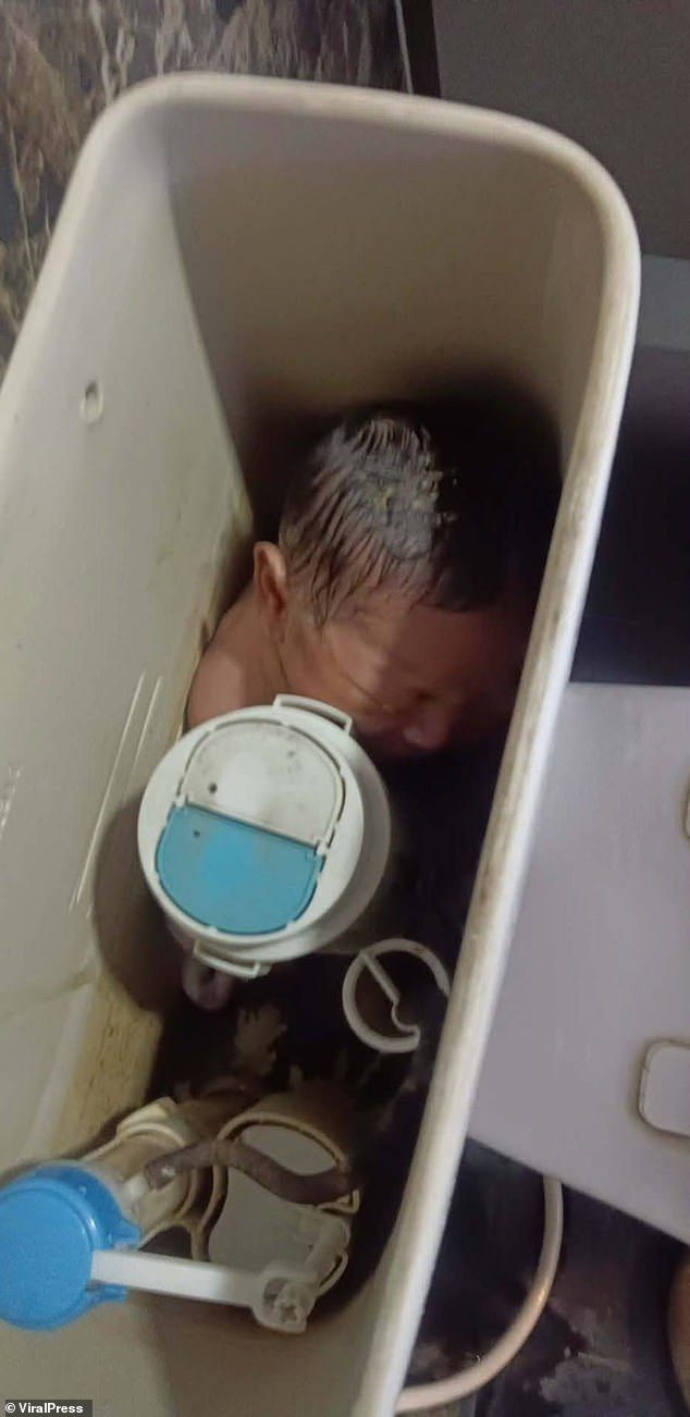 An abandoned baby girl was found alive, stuffed inside a toilet tank in Thailand